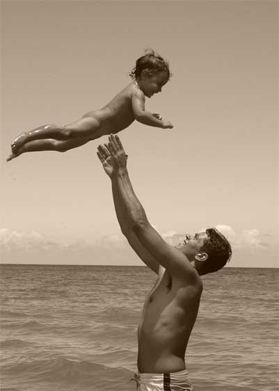 father-son father play with son pulling her up in the air father sone playing near sea ldad lifting his baby up in the air father dad son love wonderful moments with my dad Father's day